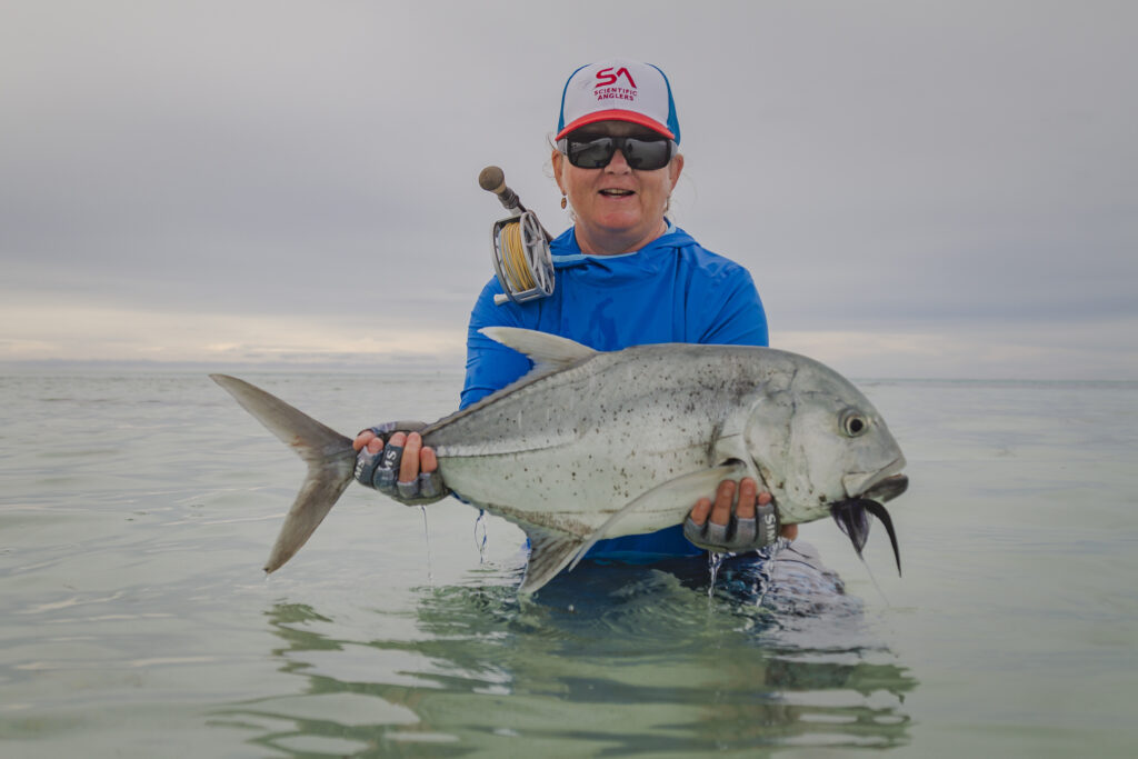 Angler with her catch - a giant trevally