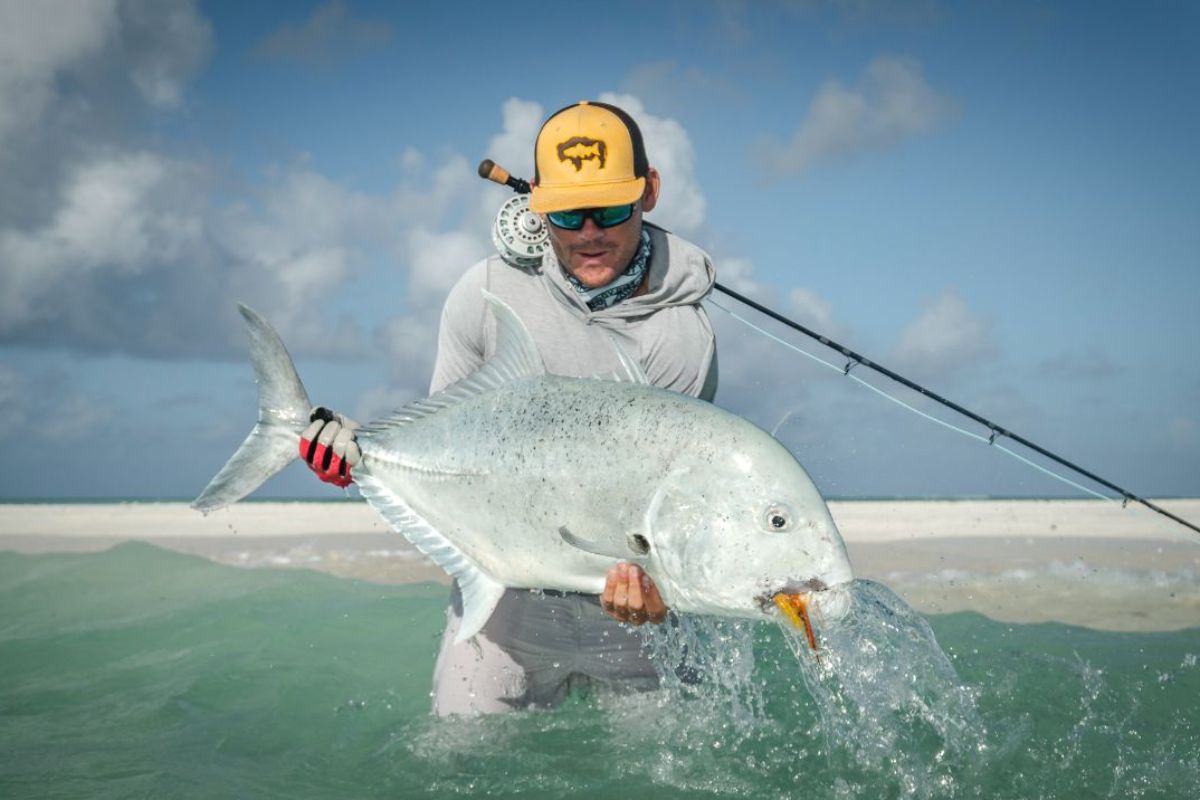 Angler at Alphonse Island with Giant Trevally