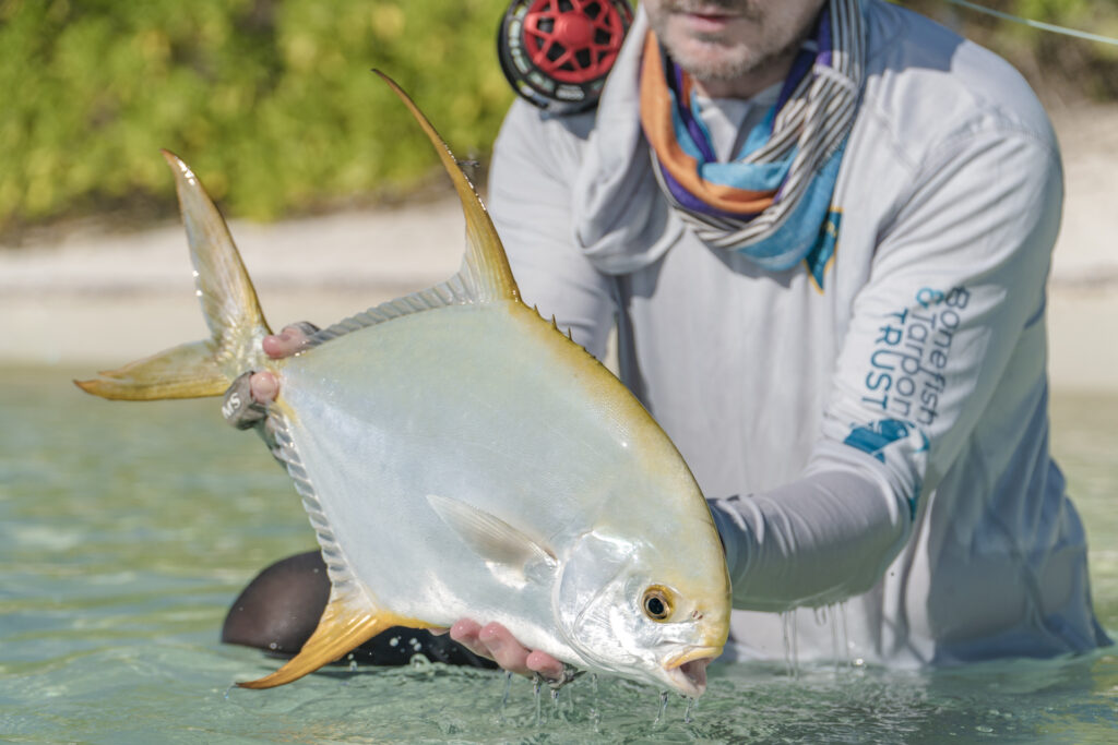 Angler with the holy grail of fish, a permit