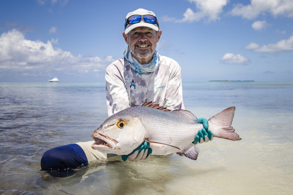Angler at Alphonse with his catch