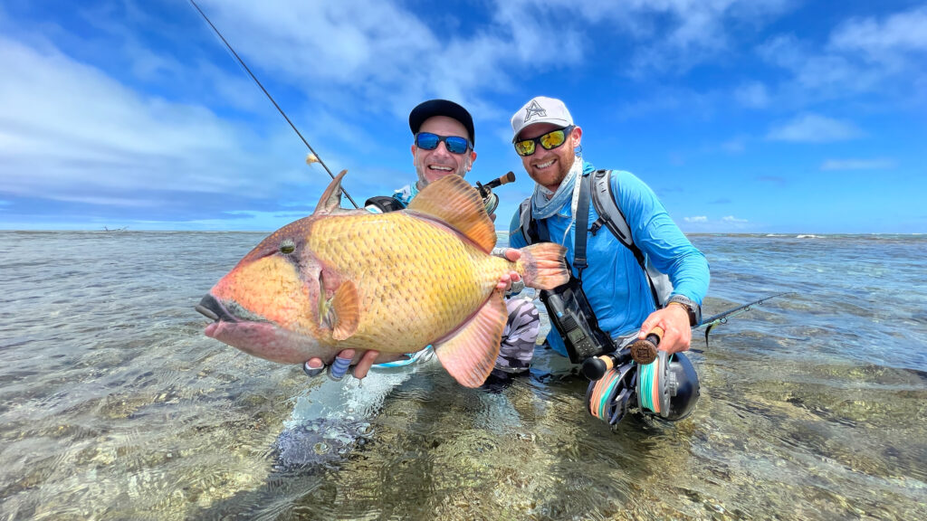 Austrian Outdoor Sports team members with their triggerfishcatch