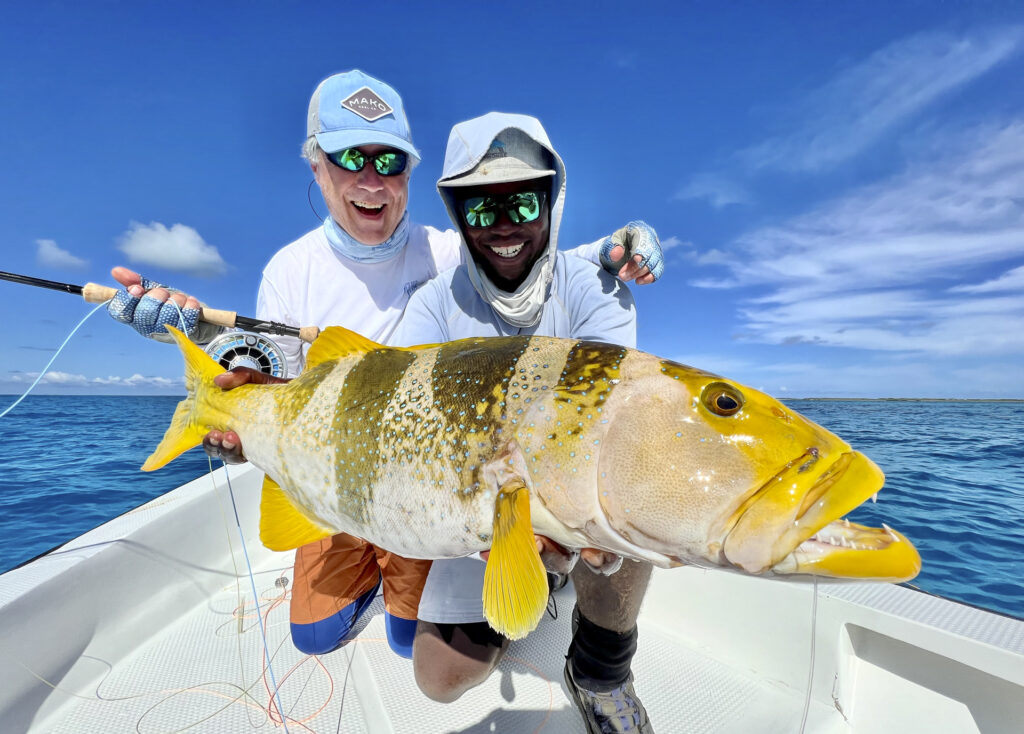 Anglers with a grouper at Cosmoledo