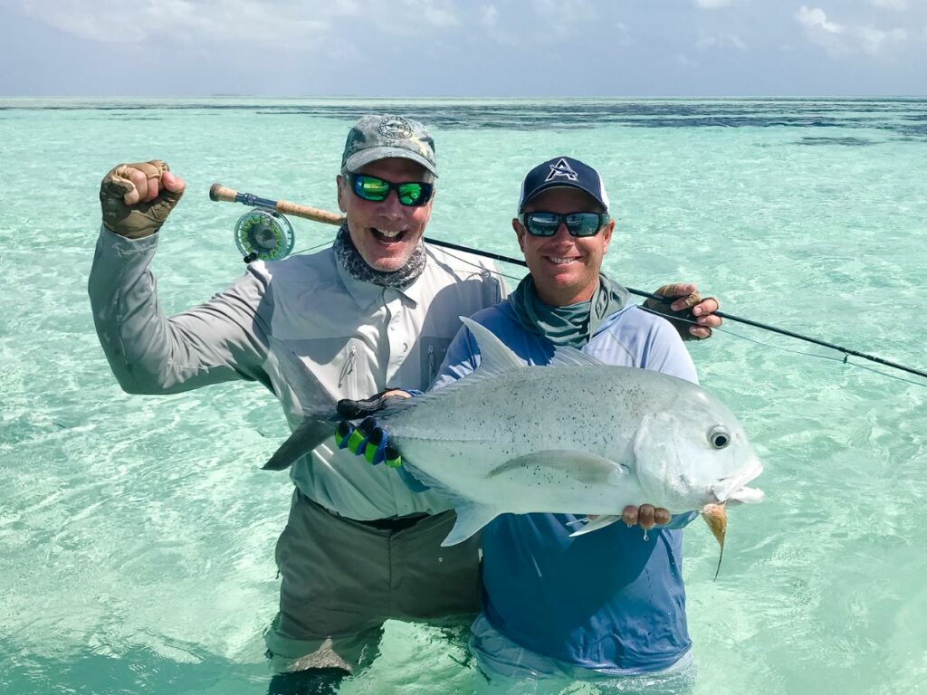 This team of fishermen showing off their catch -a bruiser of a catch