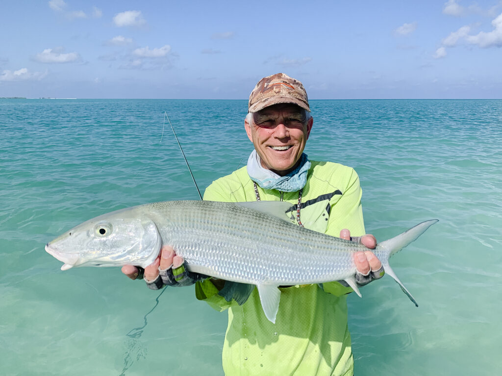 Angler with his catch - a bonefish at Alphonse Island