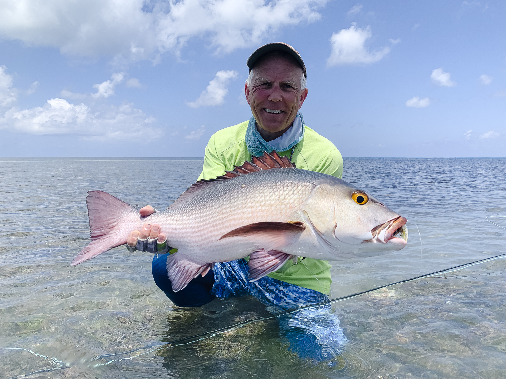 Fisherman with a bohar snapper at Alphonse Island