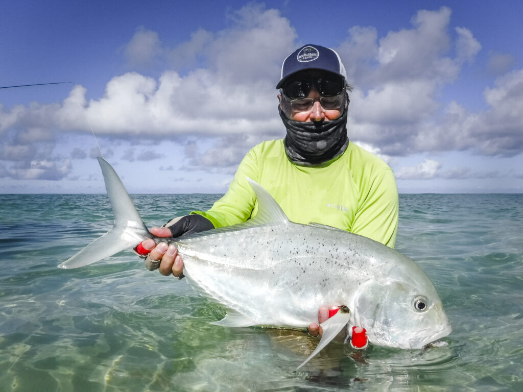 Angler with a GT at Astove Atoll