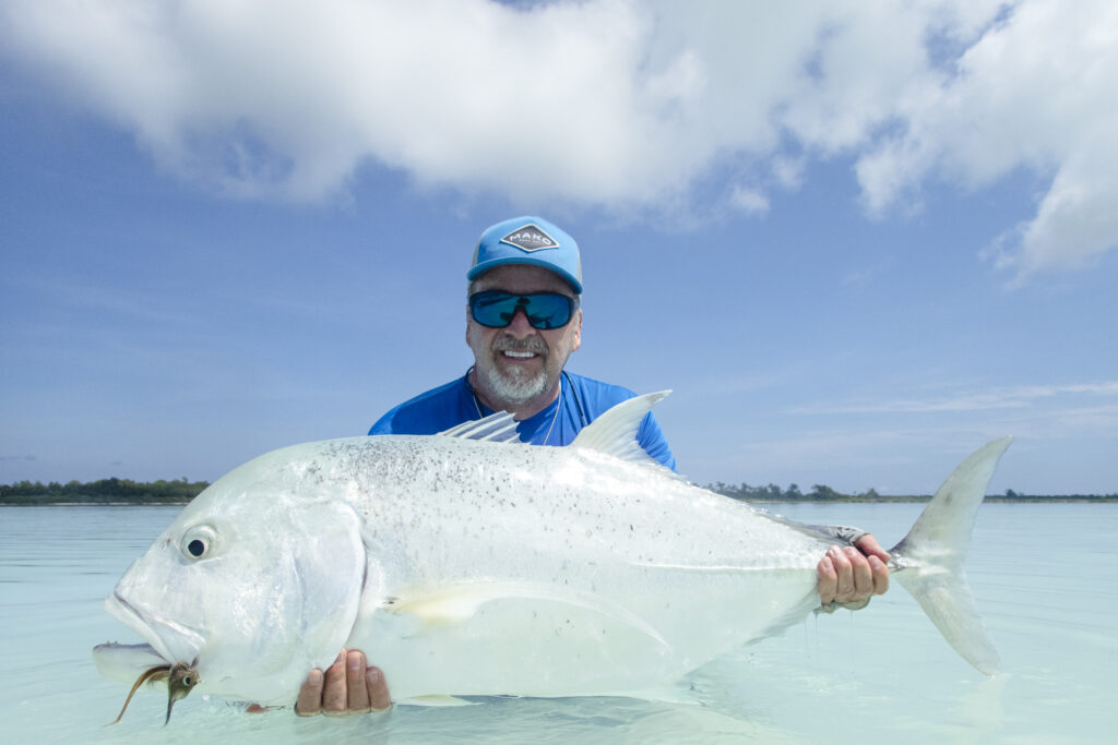Fisherman with a large giant trevally at Astove Atoll