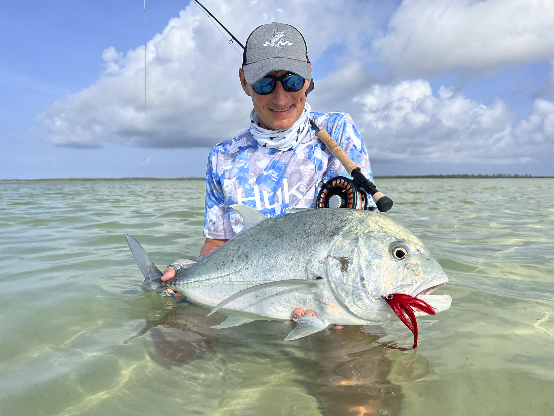 Angler with his catch, a GT