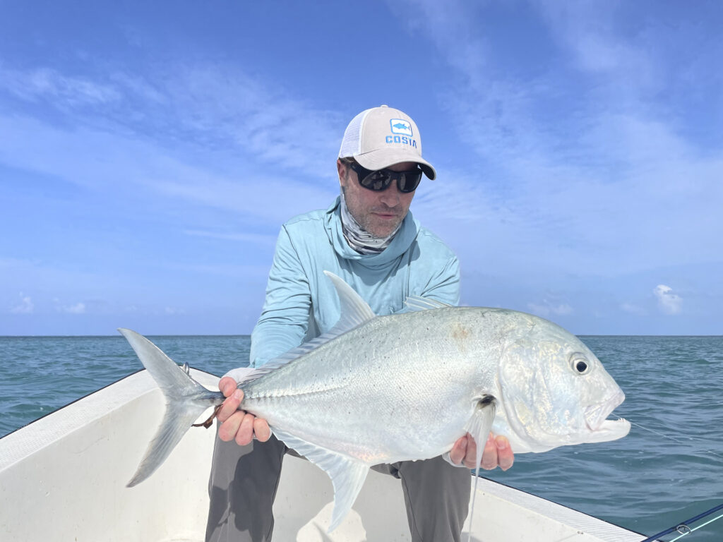 Angler with his catch, a GT