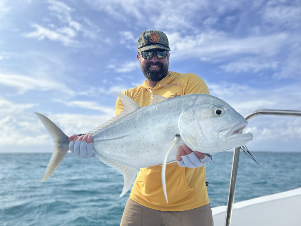 Angler with his catch, a GT