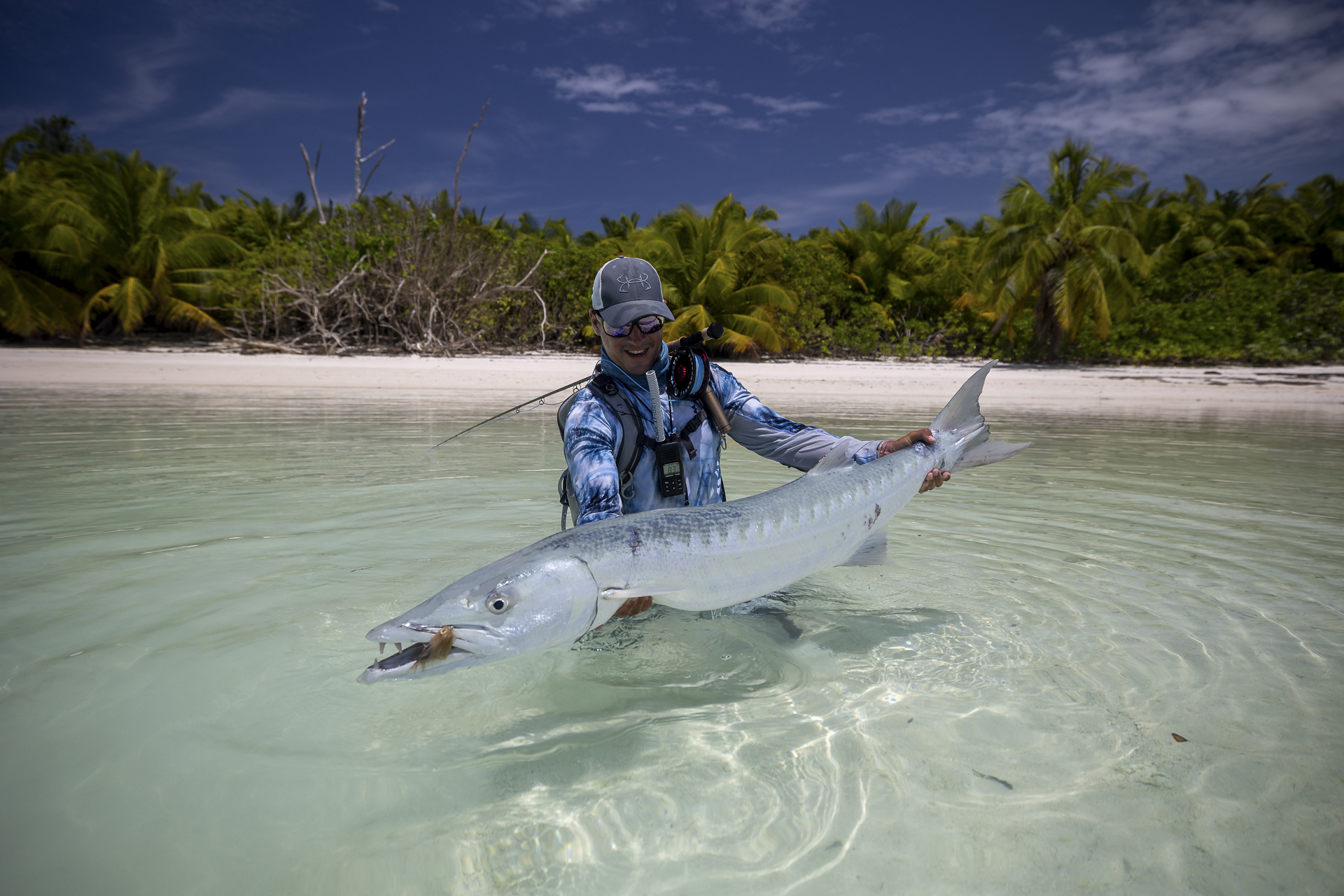 Fisherman with a barracuda caught at Farquhar Atoll