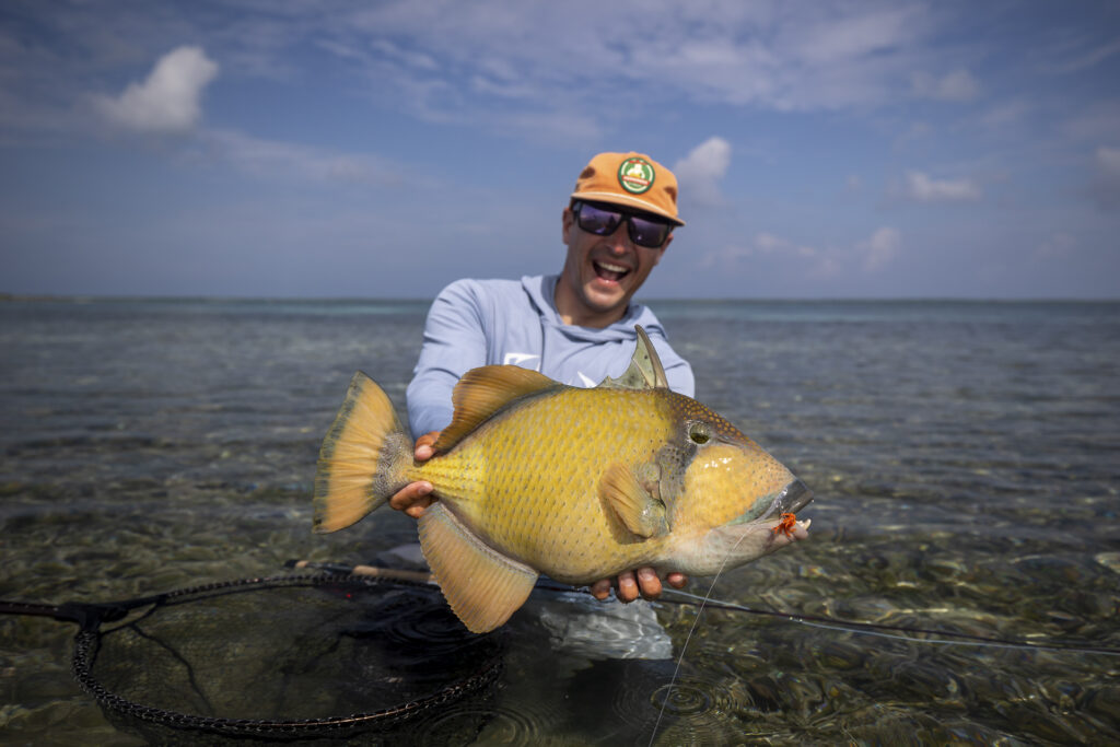 Fisherman with a triggerfish caught at Farquhar Atoll