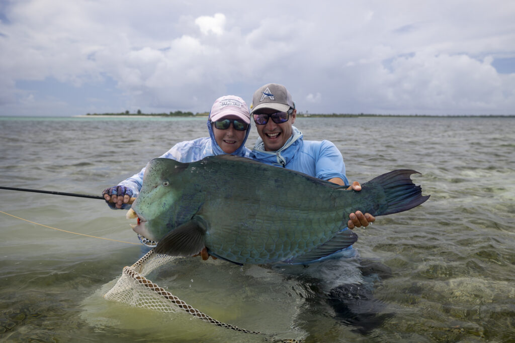 Two anglers showing off their good catch at Farquhar Atoll