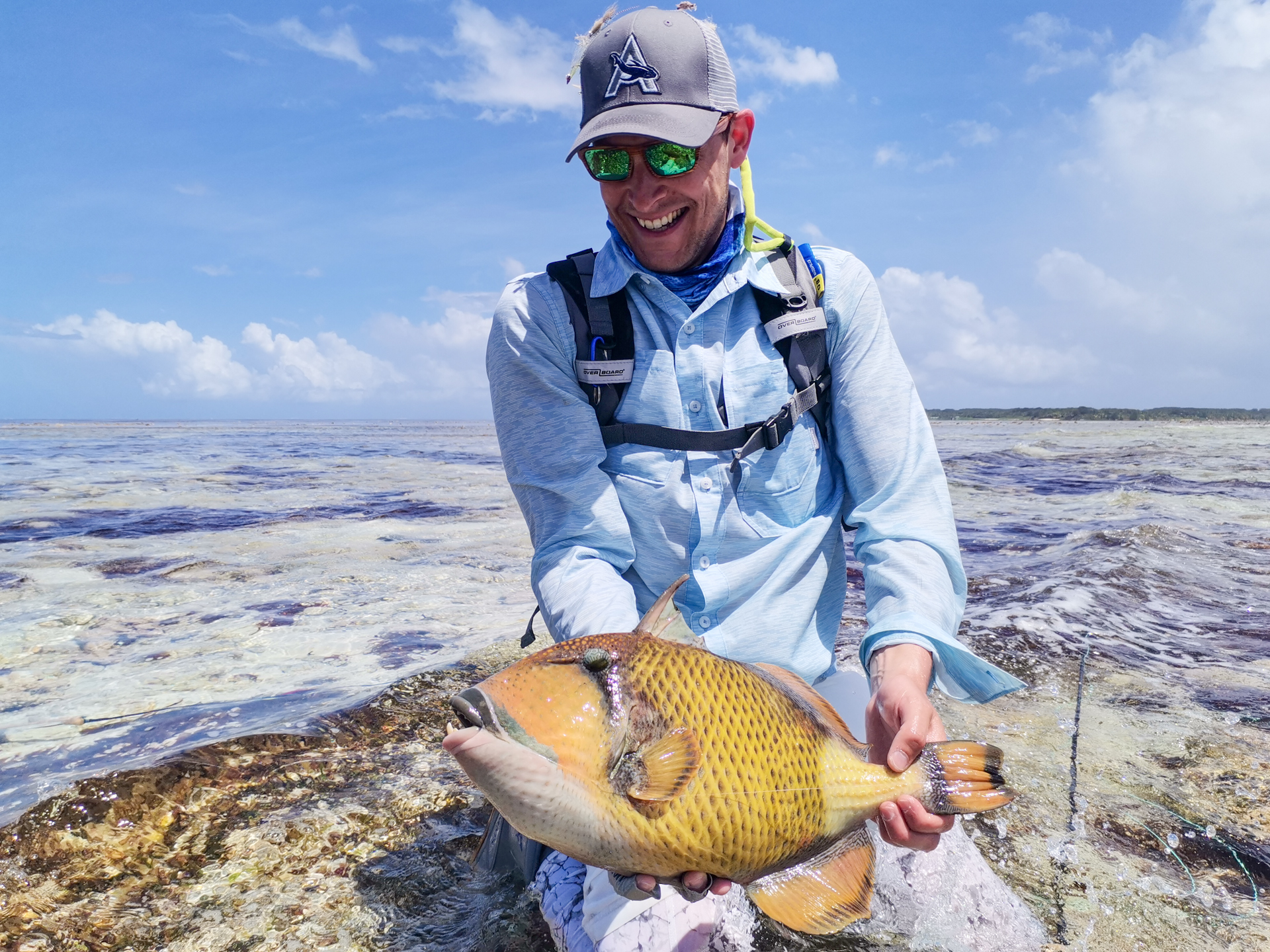 Fisherman with a triggerfish he targeted