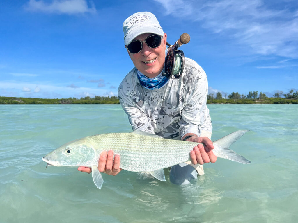 Angler with his catch just need a measuring tape