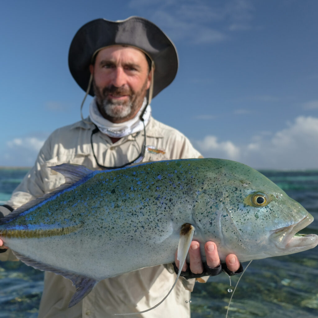 angler with Bluefin Trevally