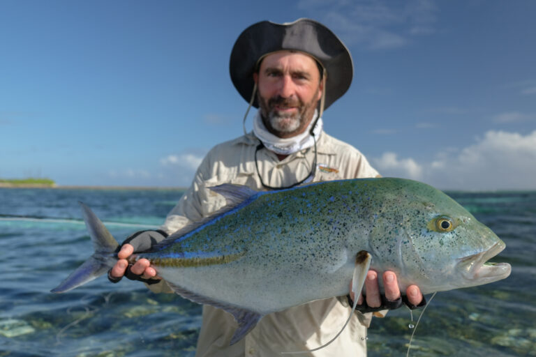 fisherman with his bluefin trevally
