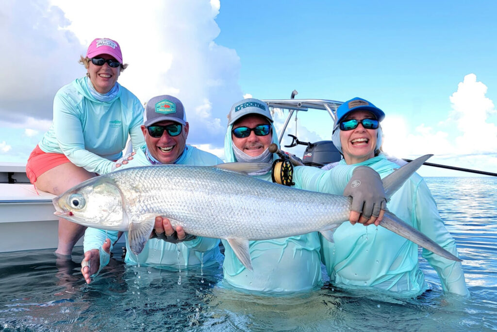 Anglers showing off a milkfish ctach at Alphonse