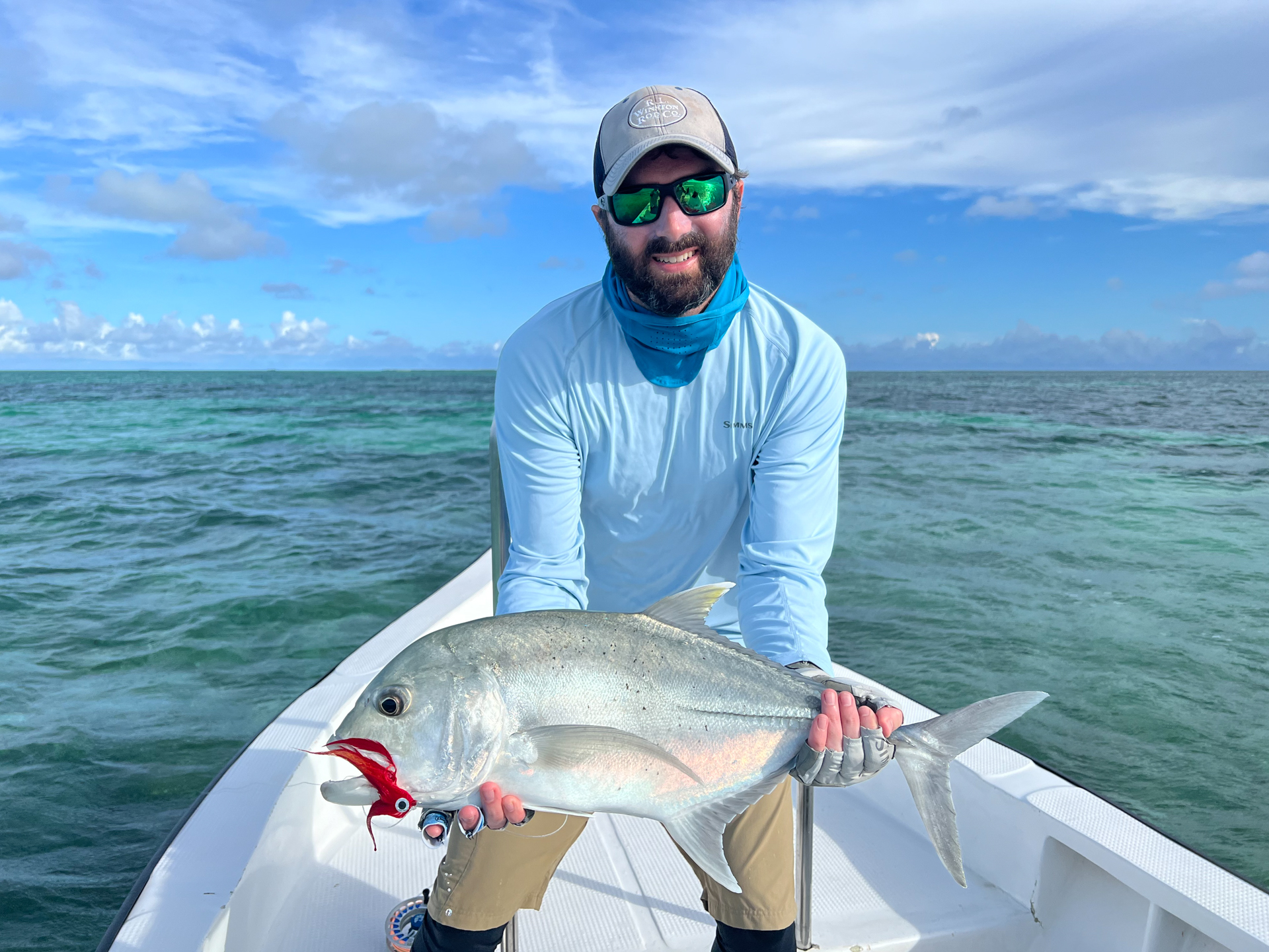 Angler at Cosmoledo Atoll with a GT