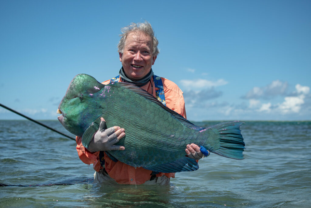 Angler with a bumphead parrotfish at Farquhar Atoll