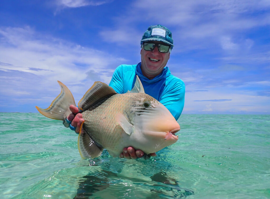 Angler with his catch of a triggerfish