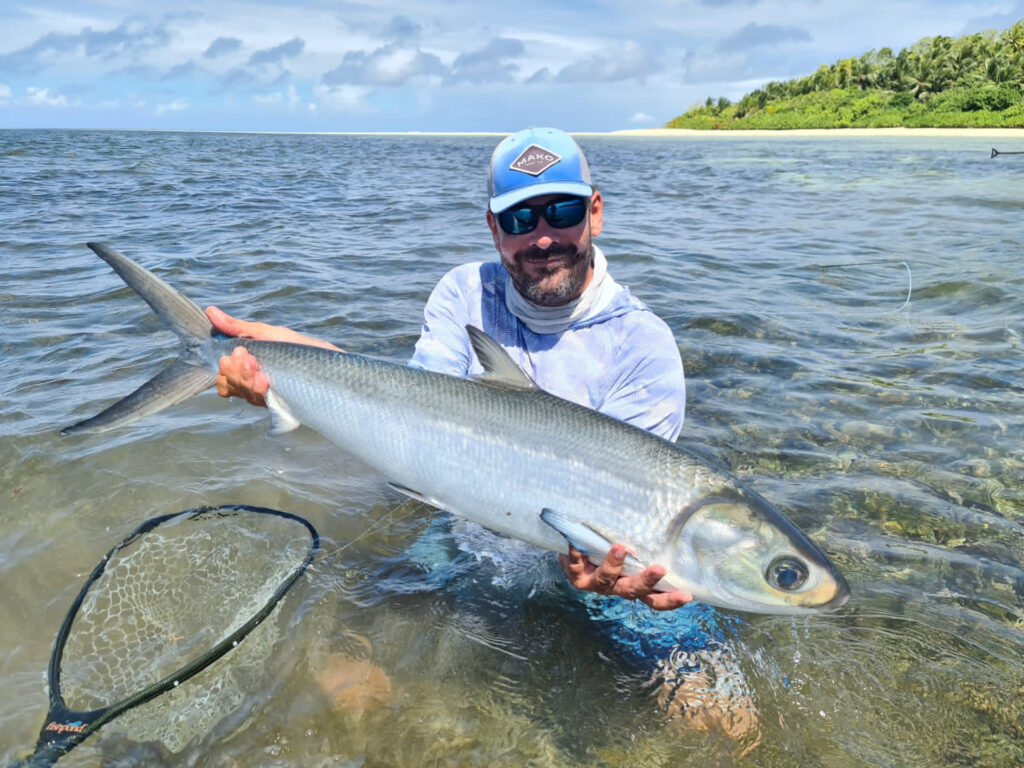 fisherman holding up his catch