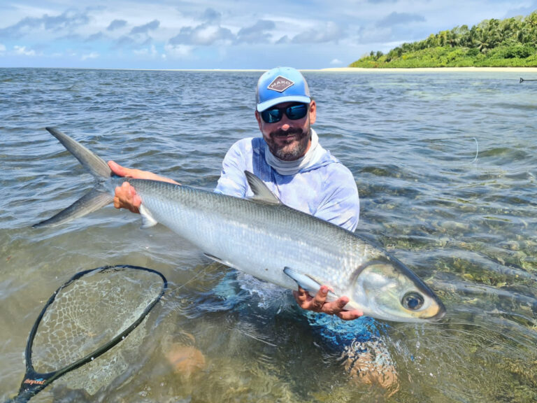 fisherman holding up his catch