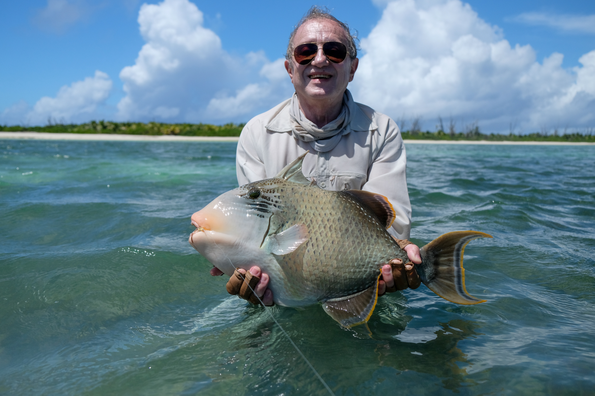 Fisherman with a triggerfish after joining us