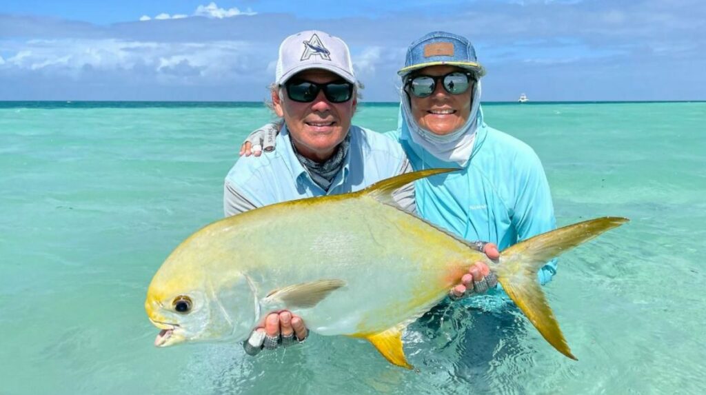 Anglers holding up a permit