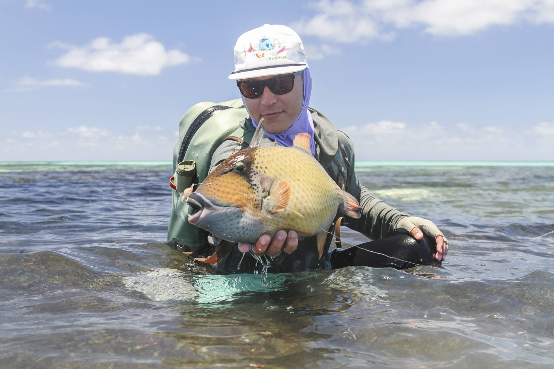Angler with a triggerfish
