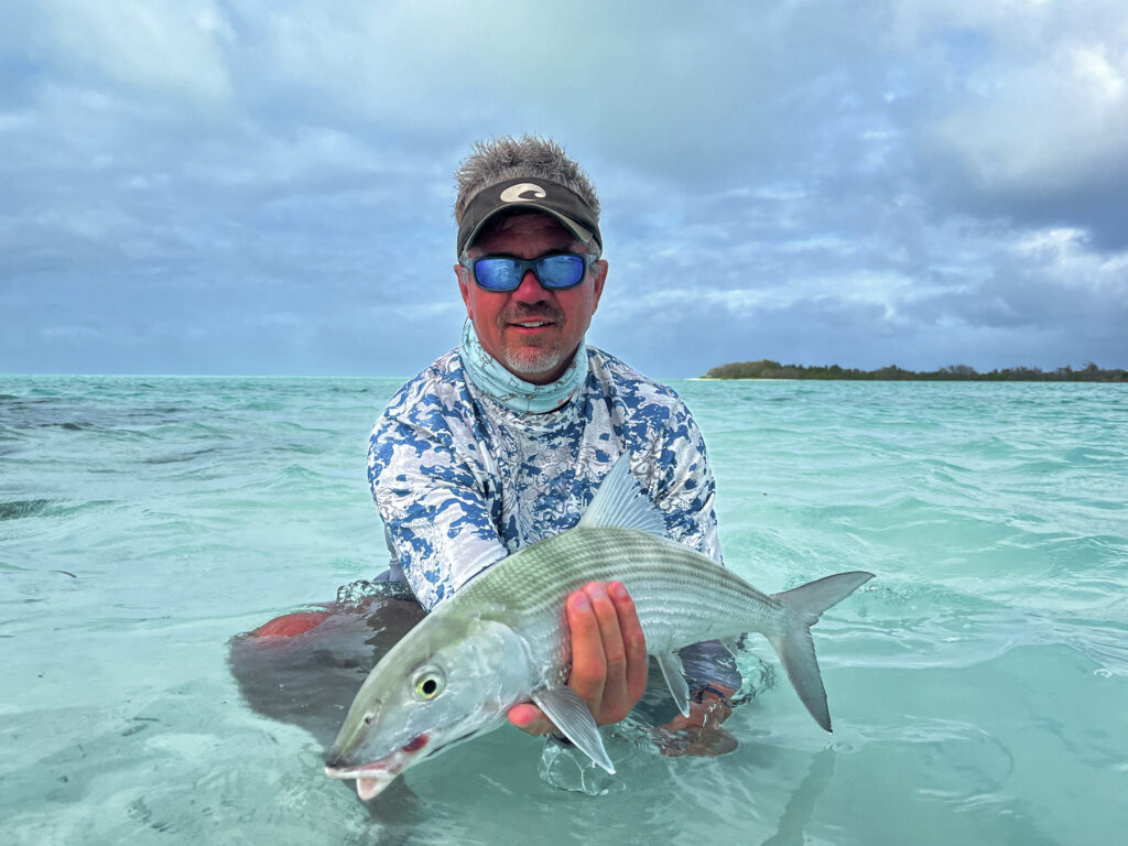Angler with his catch - warm up to catch more