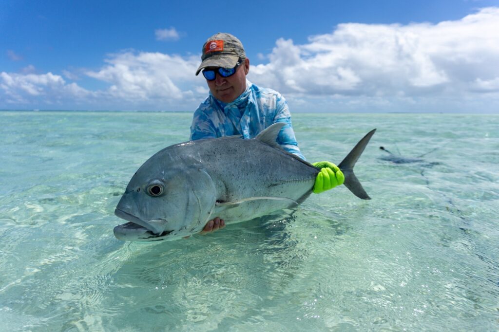 An angler with a GT landed at Alphonse