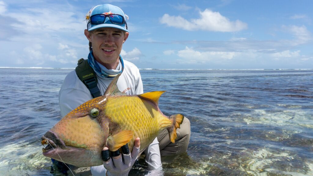 Fly fisherman with a triggerfish