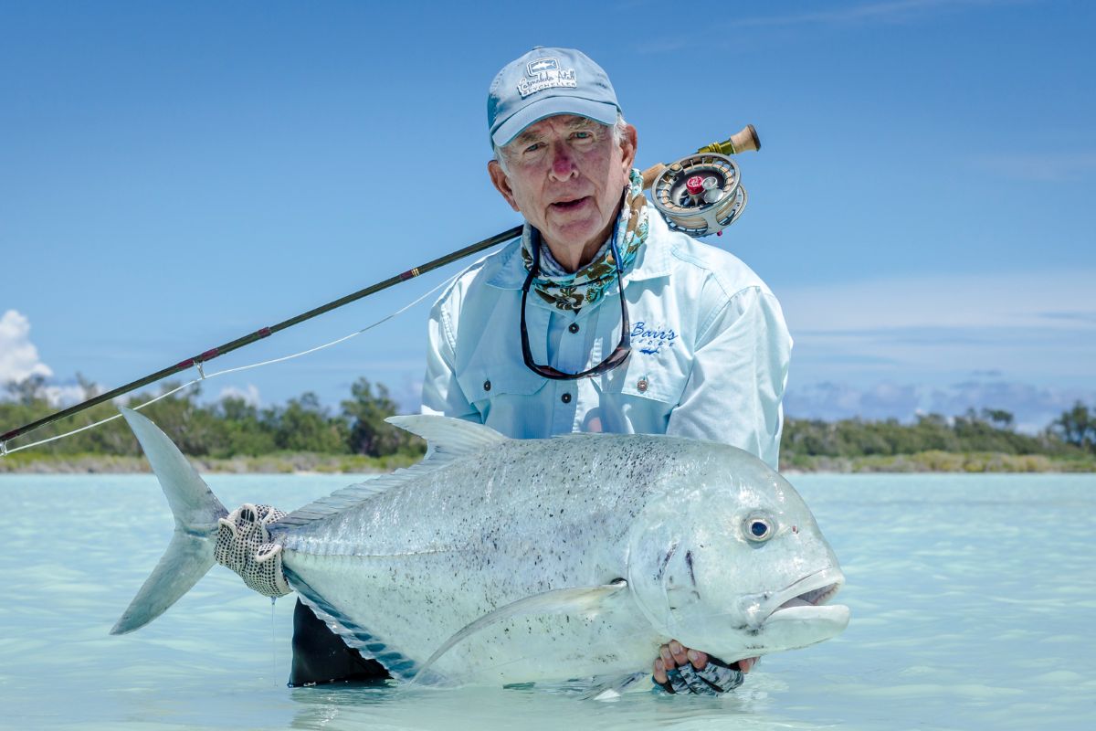 Astove angler making a catch near the lagoon