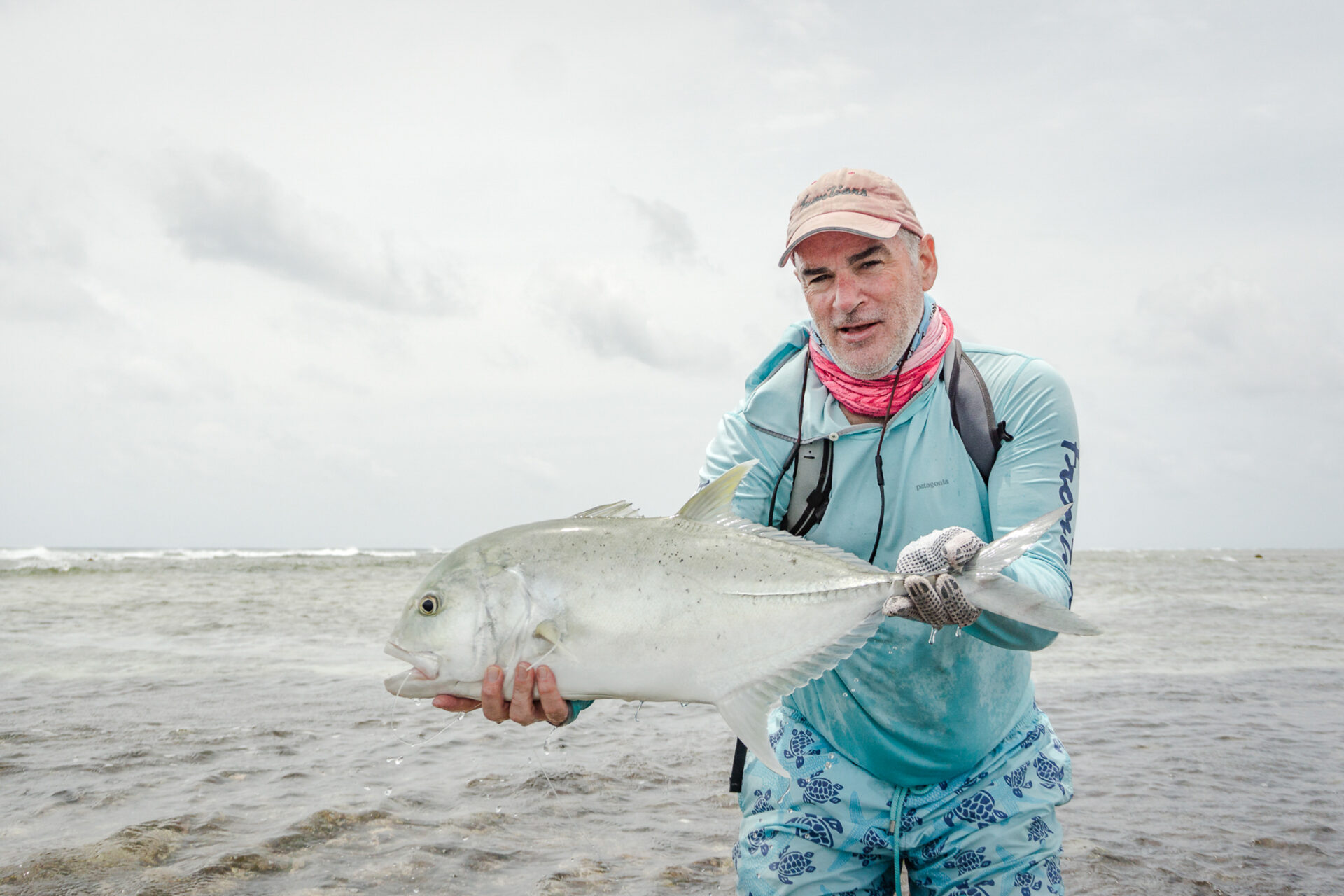 Angler with his GT catch at Astove Atoll