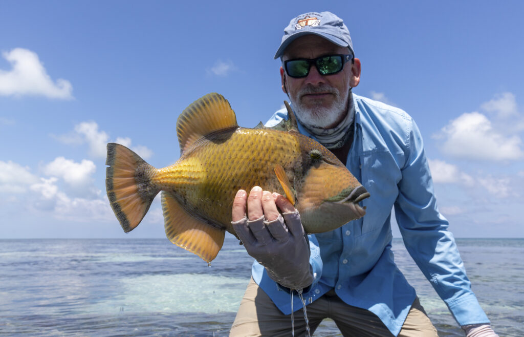 Farquhar fisherman with a triggerfish