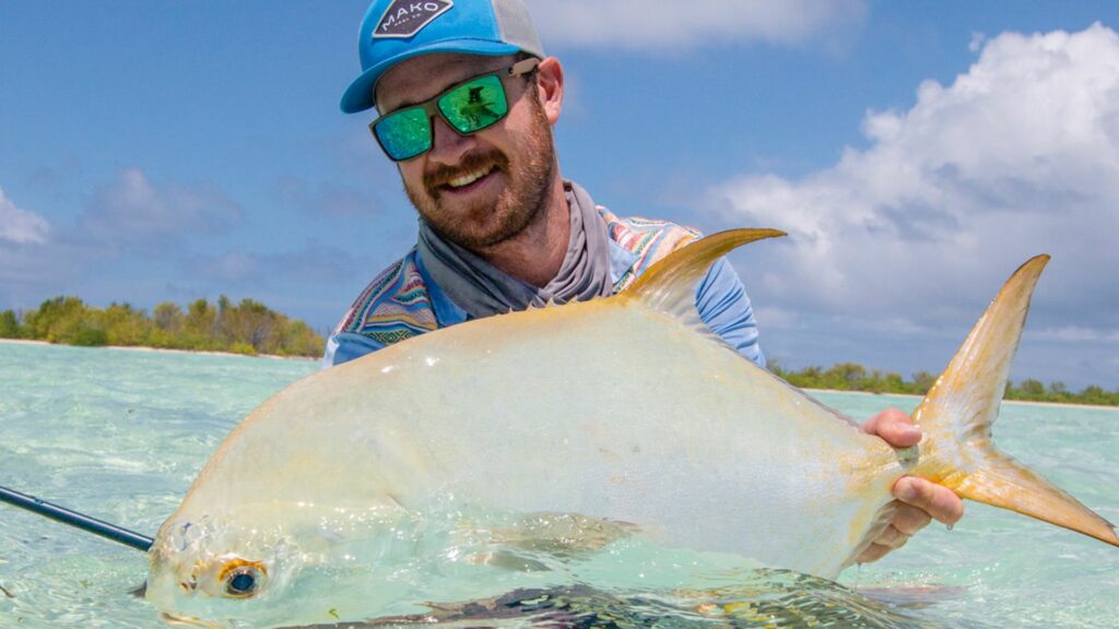 Angler with a permit caught at Alphonse Island