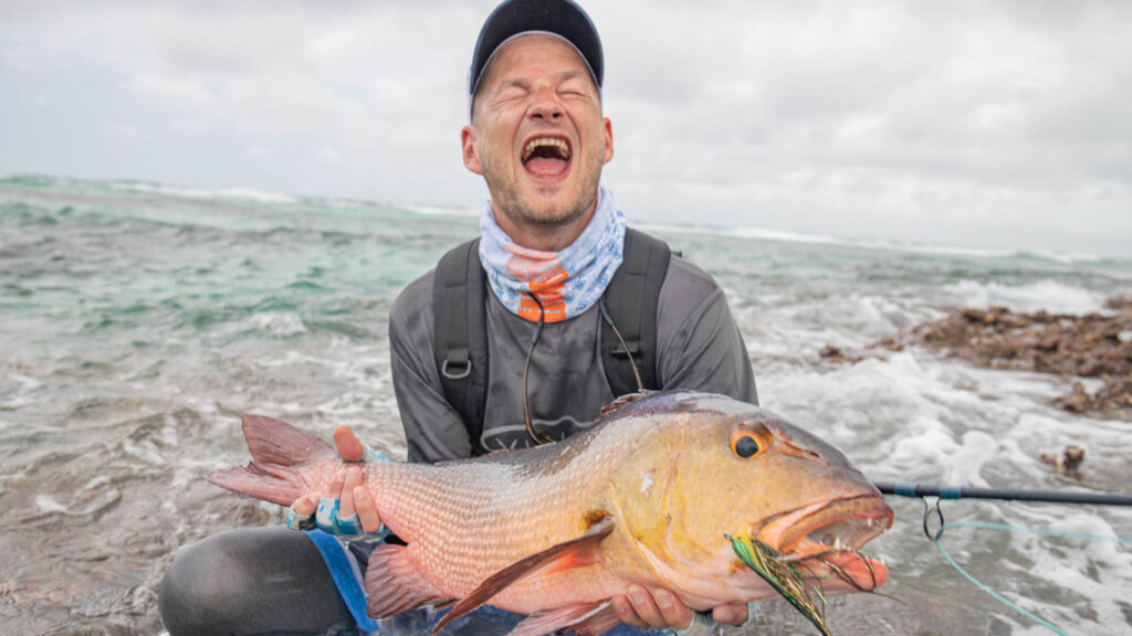 Fisherman holding his catch