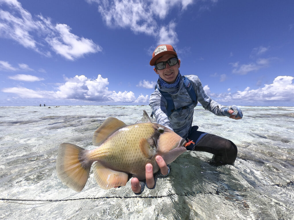 Angler with a triggerfish in the Seychelles