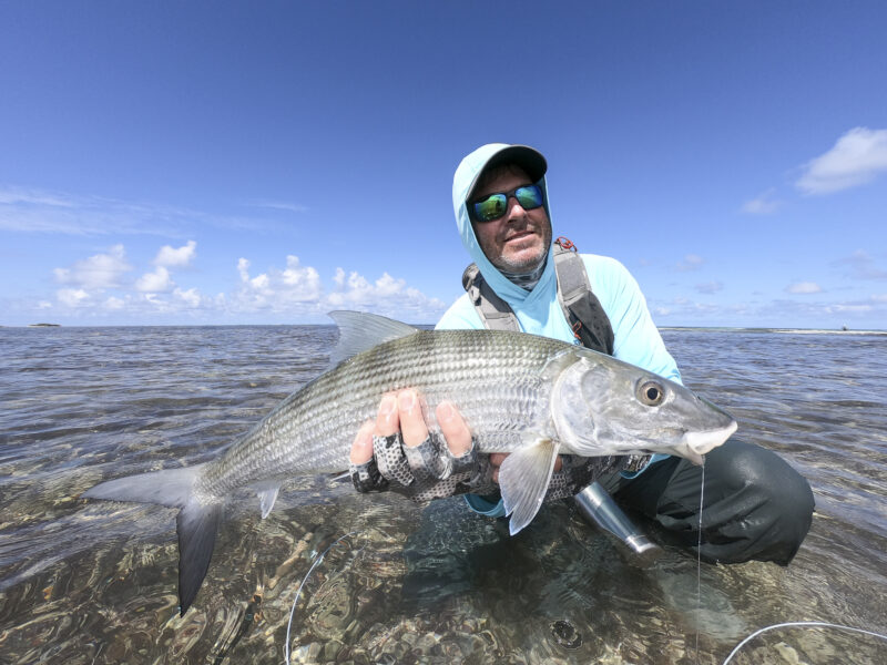 Angler with a bonefish at Astove in the Seychelles