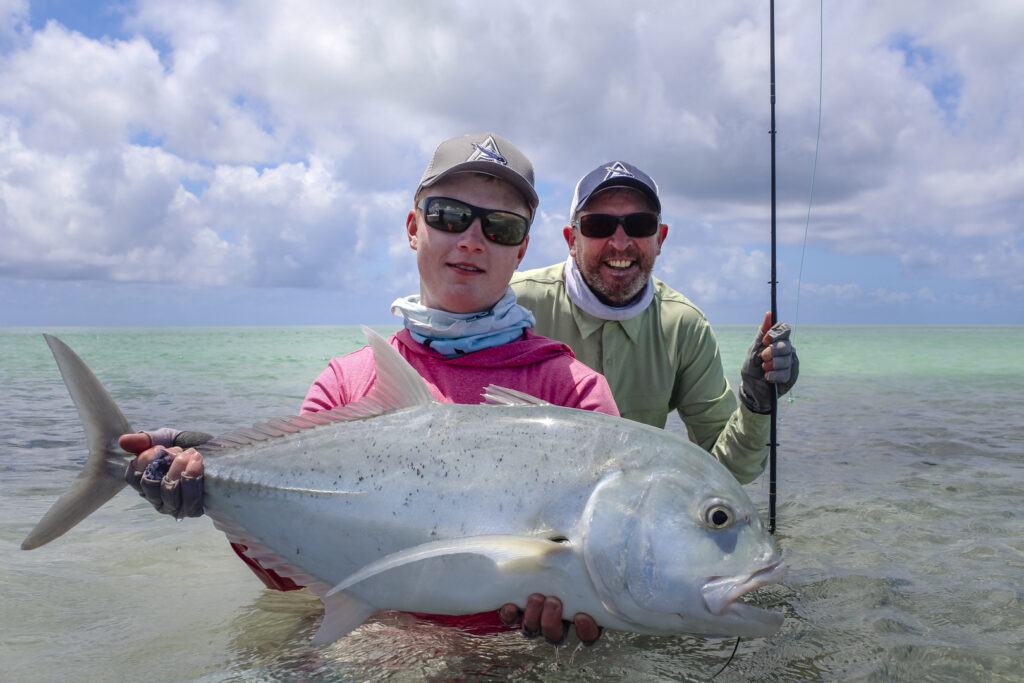 Father and son fly fishing in Seychelles