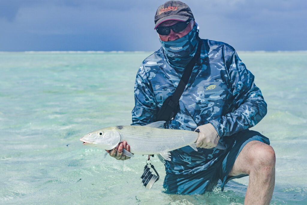 Nick Evans holding his catch