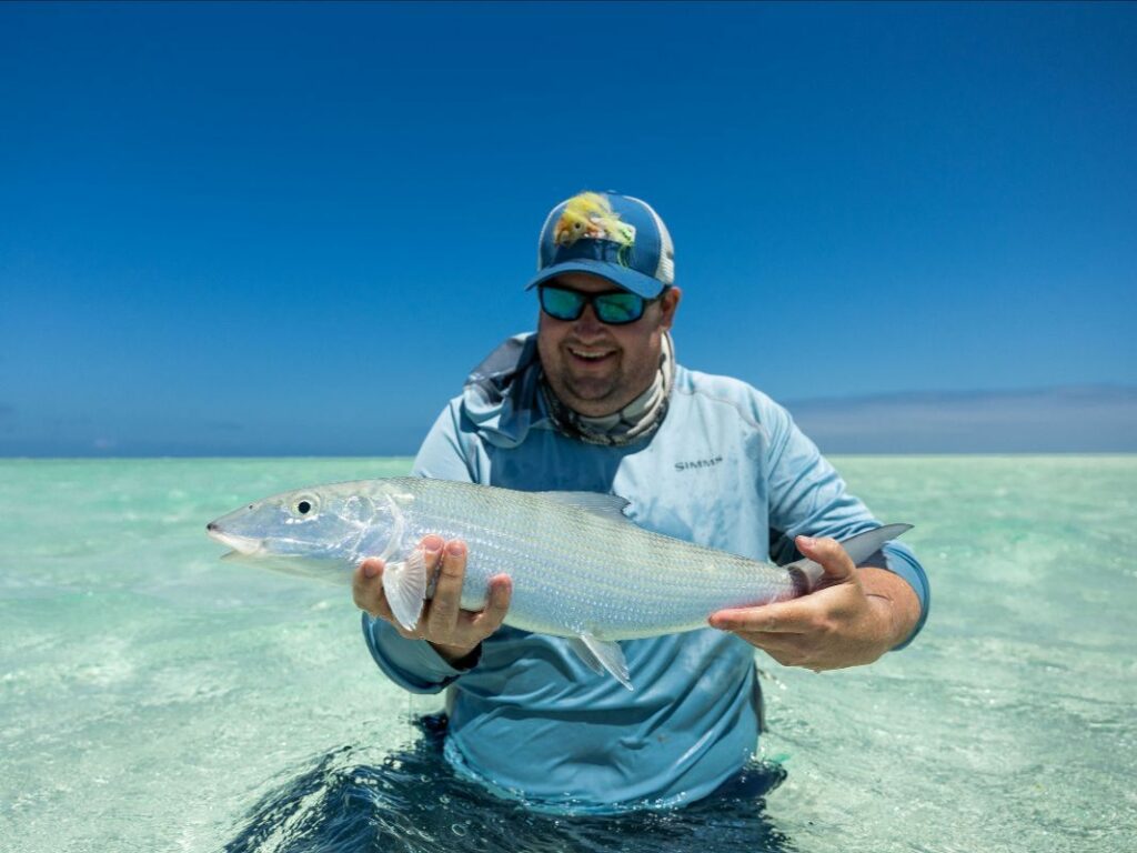 Fisherman showing off a bonefish during prime tides