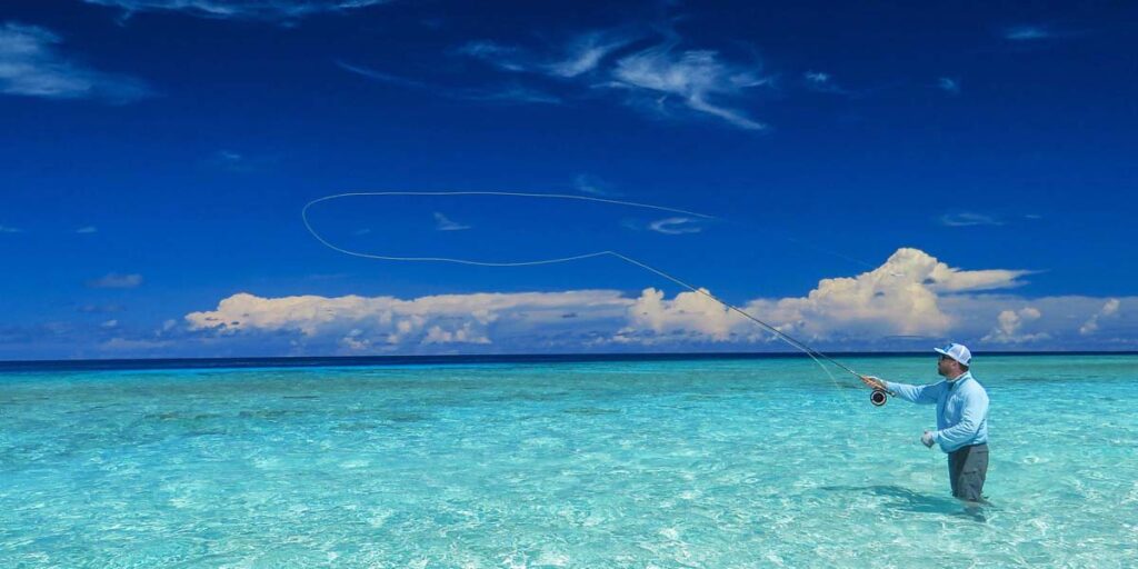 Man fly fishing in the Seychelles - saltwater fish facts