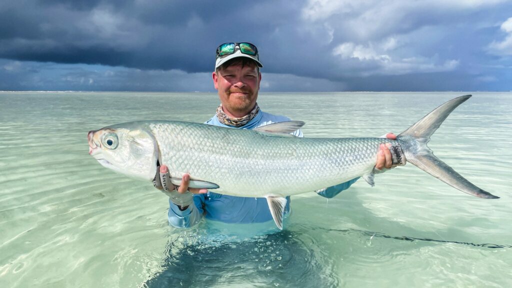 Milkfish myth busted - angler holding a milkfish