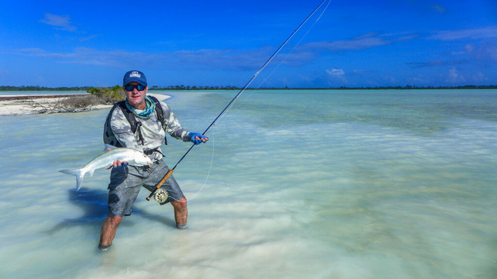 Fly fisherman at wild Astove Atoll fishing bonefish