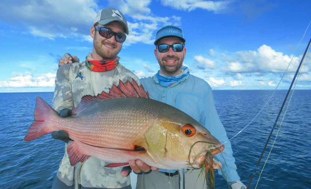 Fishermen at wild Astove Atoll