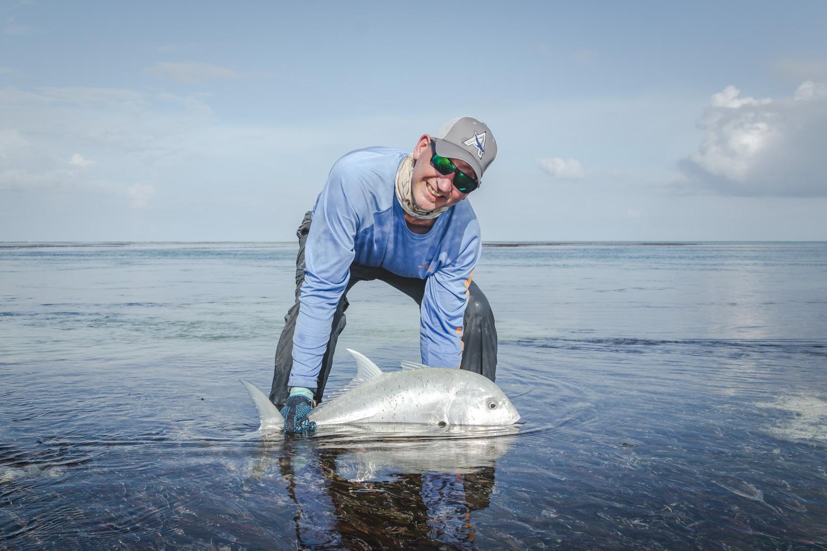 Angler releasing a GT